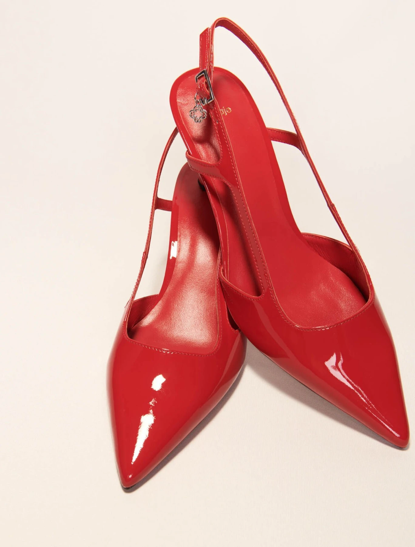 Patent leather slingback pumps
 Gallery