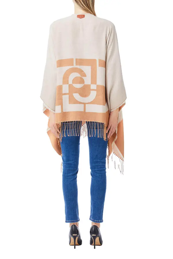 Poncho with logo and fringes 1 Image