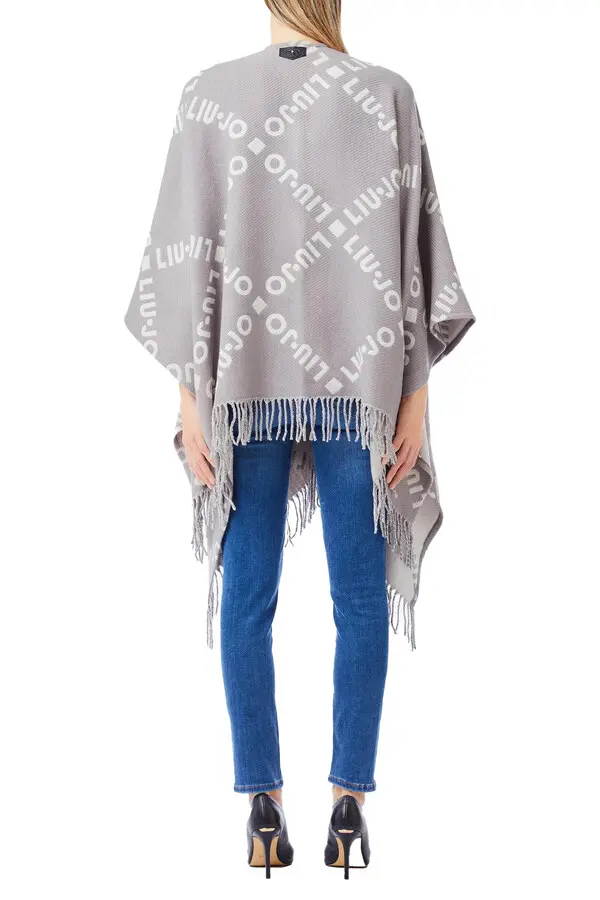 Poncho with logo and fringes 1 Image
